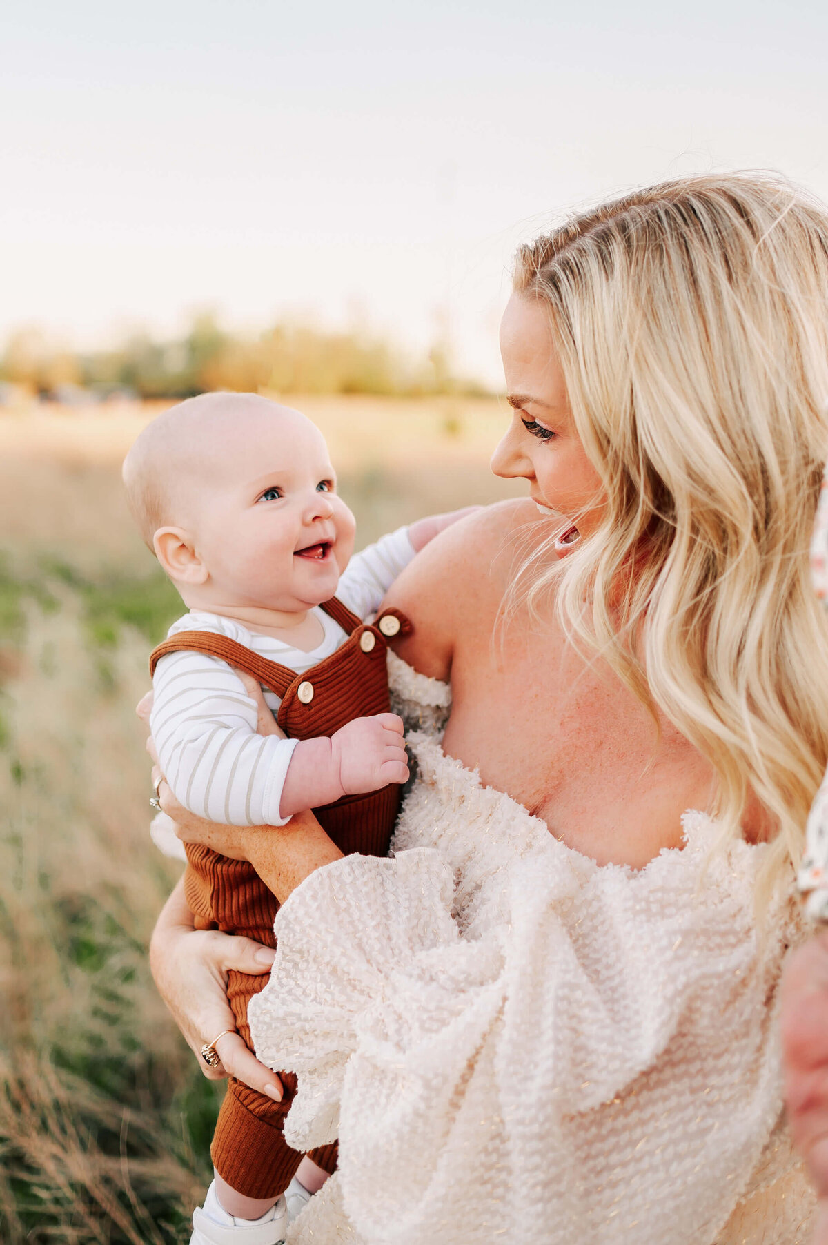 mom smiling at baby boy enjoying Springfield MO family photography