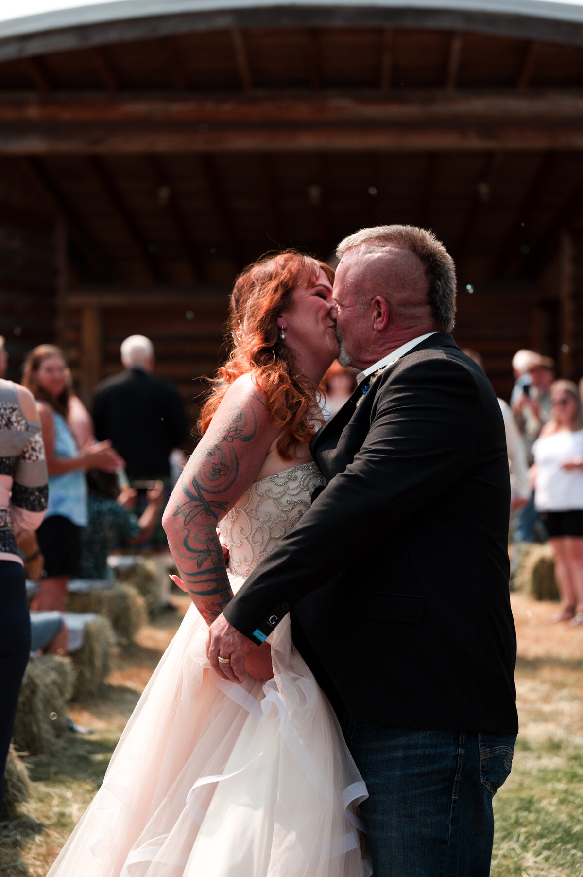 Vancouver Island bride and groom share a kiss during their wedding in Coombs, BC