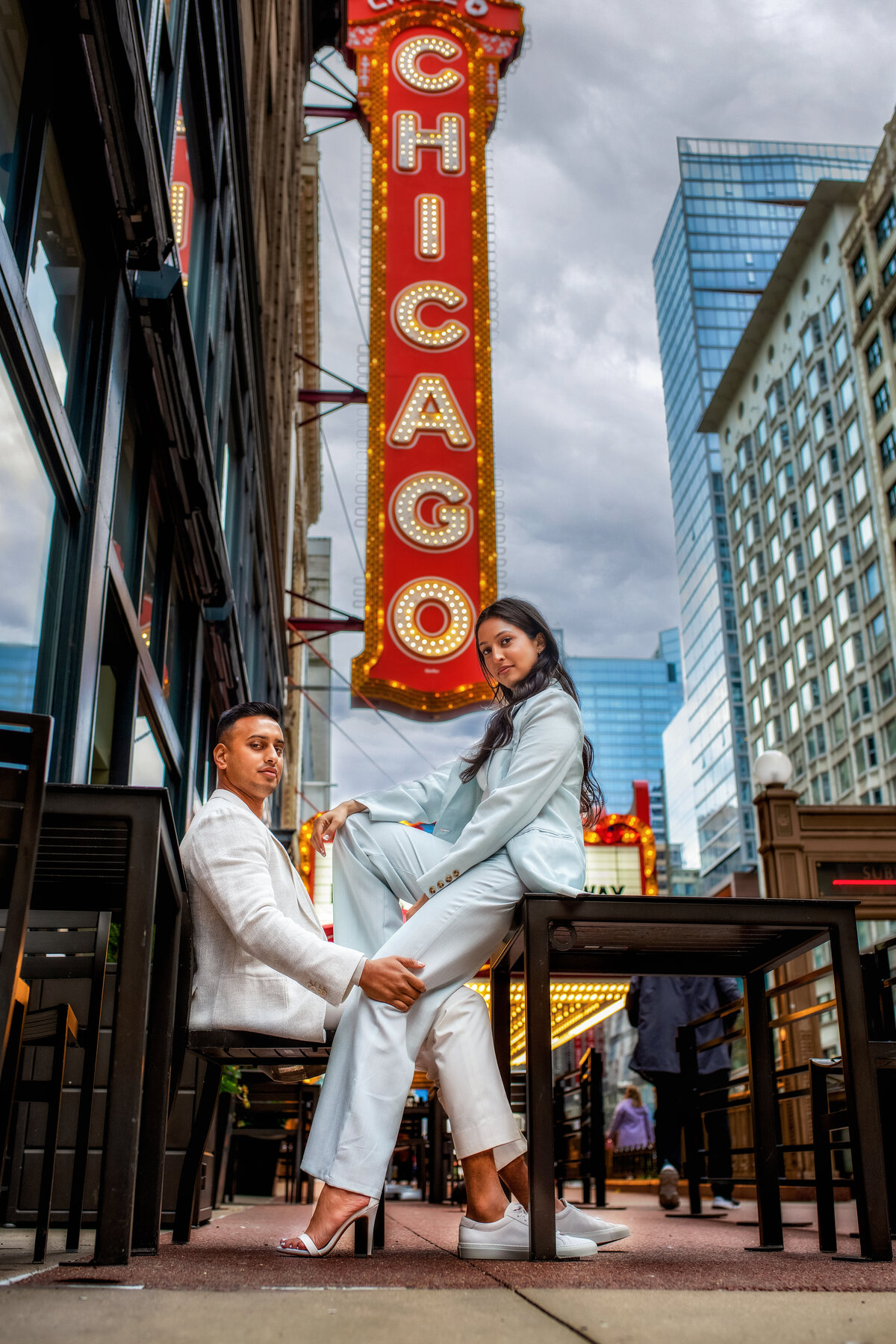 Stylish engagement fashion photoshoot by famous Chicago sign