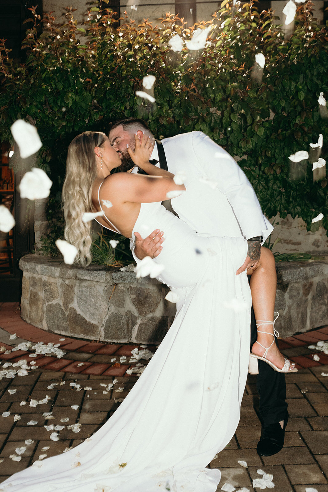 bride-and-groom-kissing-wedding-portraits-at-night-saint-clements-castle