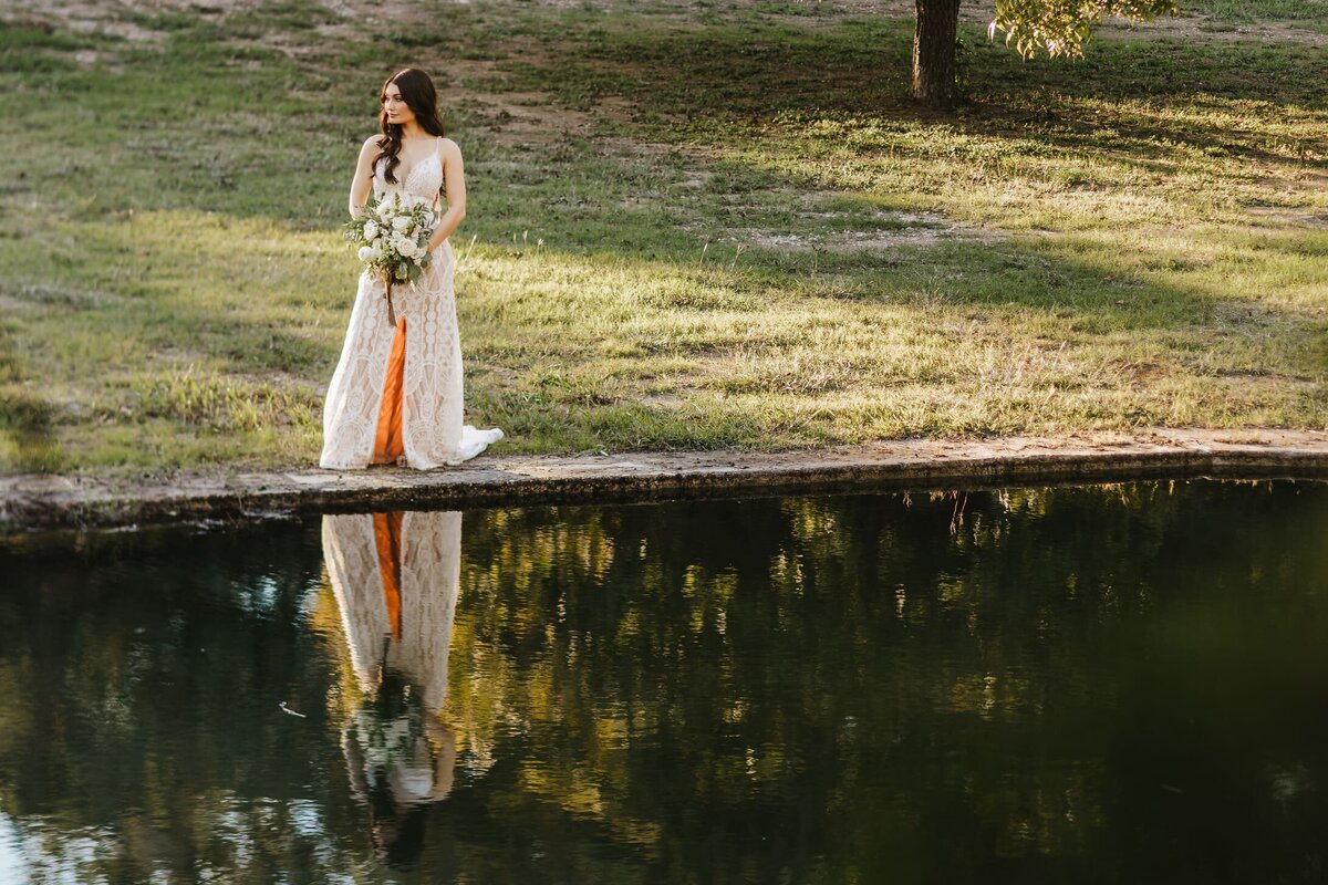 Bride picture by river at the Wedding venue in Wimberley, Texas