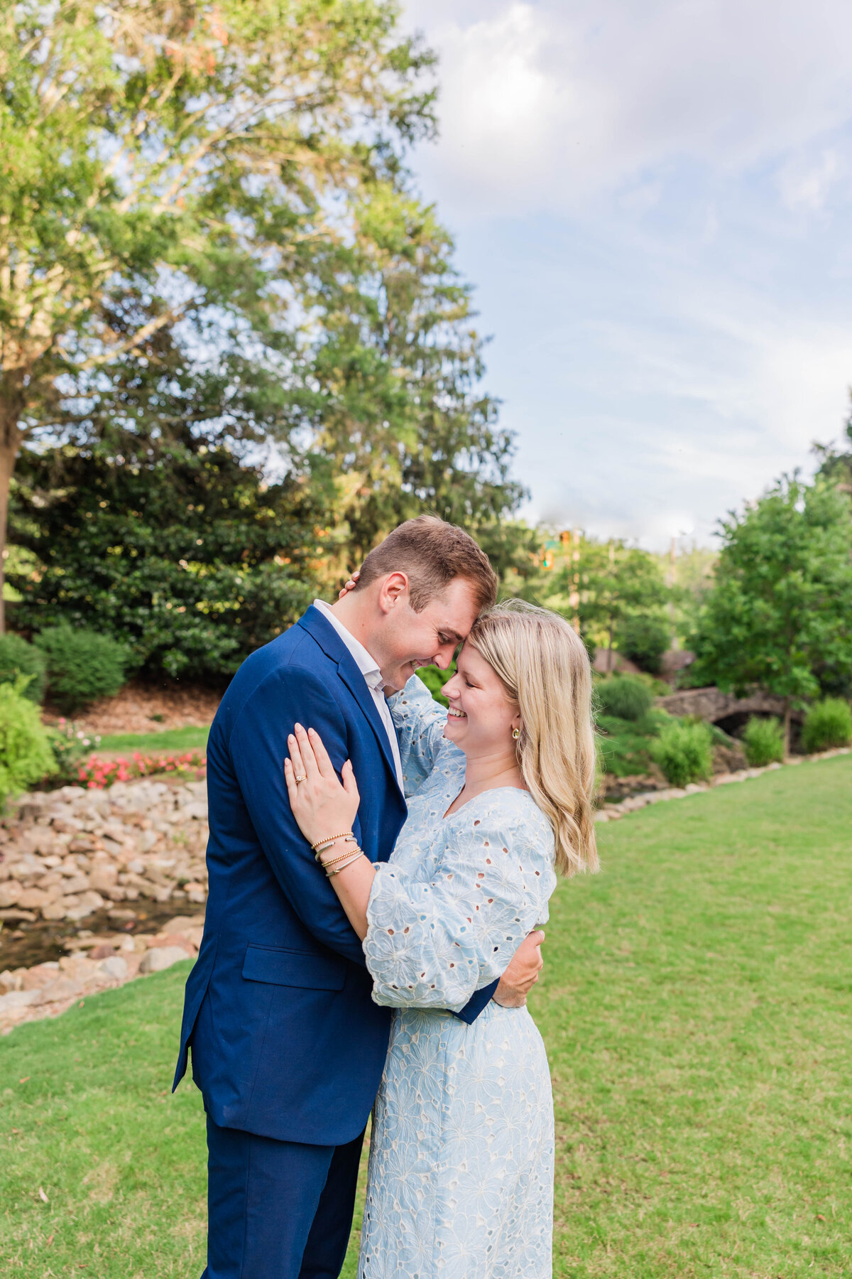 closeup of couple holding each other for engagement session at the rock quarry