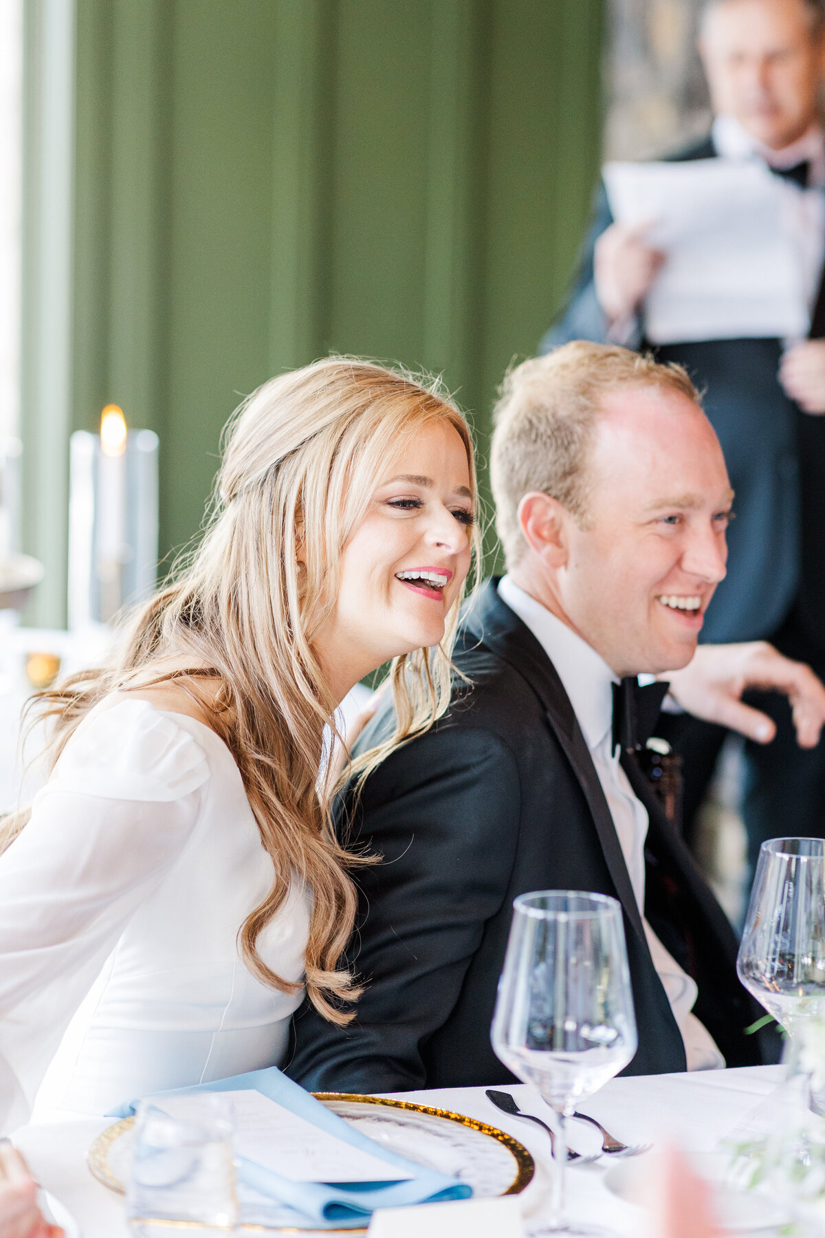 Bride and groom laughing during their reception at the Greystone Inn