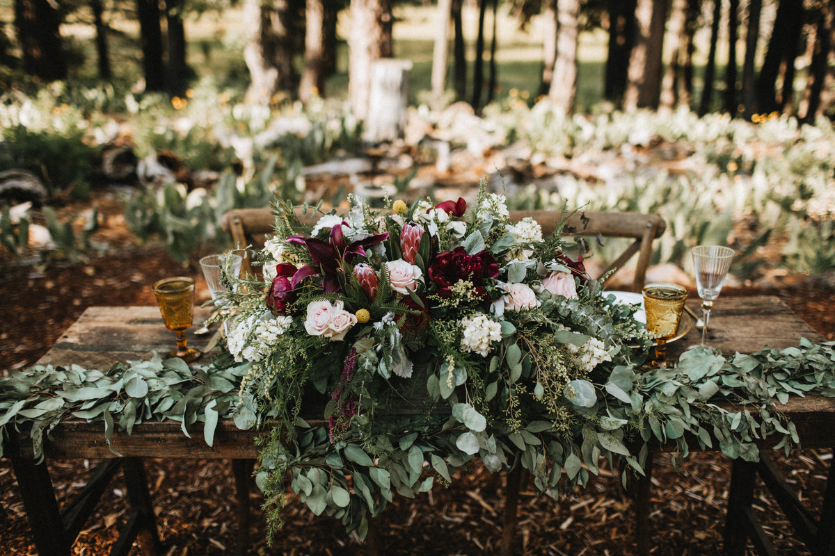 Tahoe Wedding Planners eucalyptus burgundy and white flowers at summer wedding venue Mitchell's Mountain Meadows Sierraville near Truckee, Joy of Life Events image by Lukas Koryn