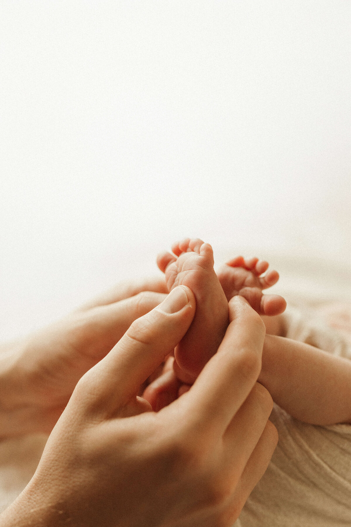 Newborn baby sleeping in swaddle during Nashville in-home lifestyle photography session