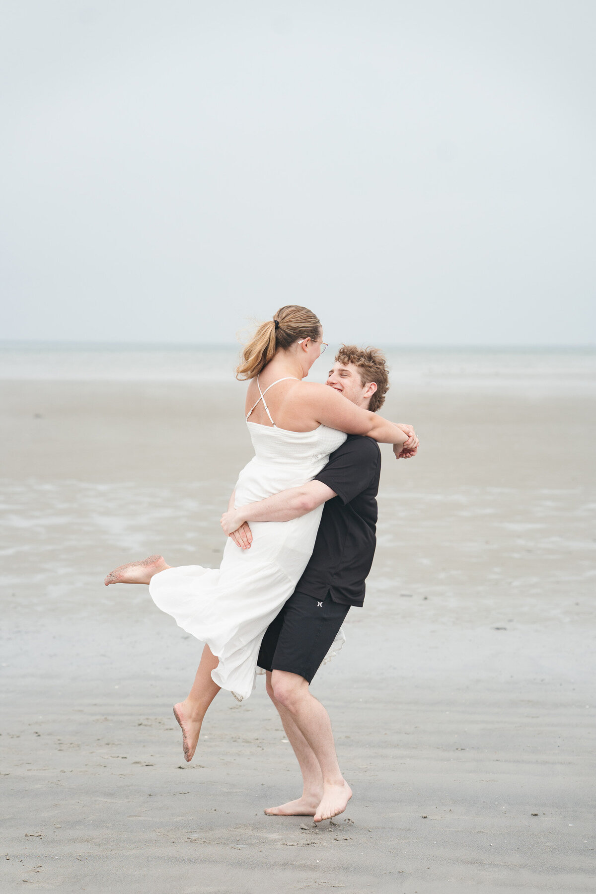 Massachusetts coastal engagement photographer capturing portraits at Wingaersheek Beach