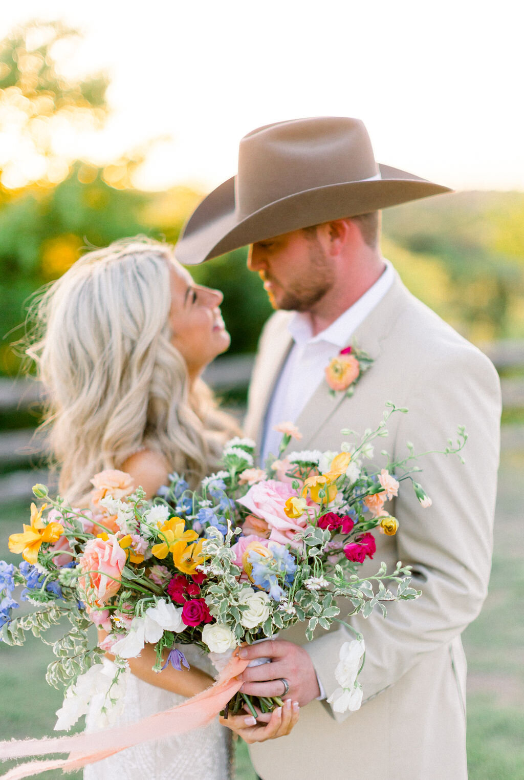 A whimsical bridal bouquet featuring wildflowers in various shades, creating a natural, flowing look.