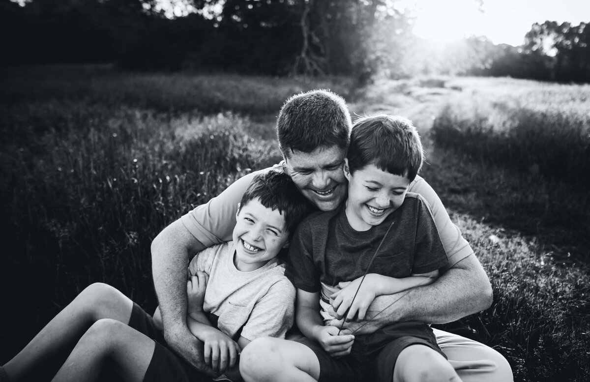 Boston Family Photographer dad hugging boys