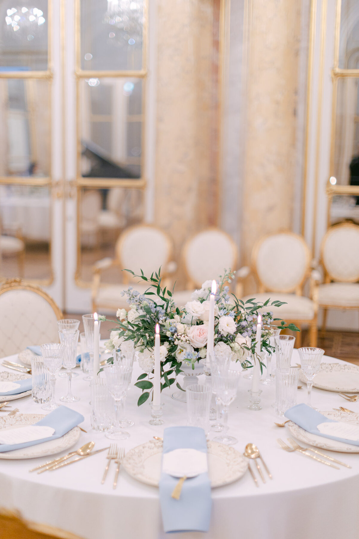 Elegant dinner table set up with blush and blue center piece at luxury palace Coburg in Vienna