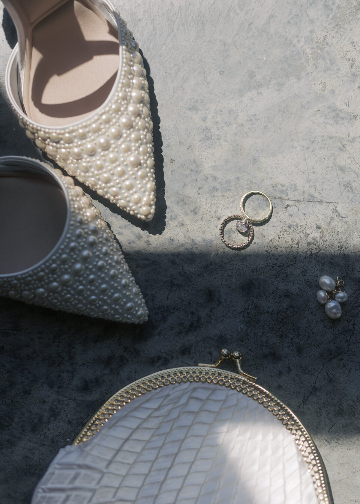 Wythe hotel bride's detail photo, with shoes with pearls, purse, rings and earrings.