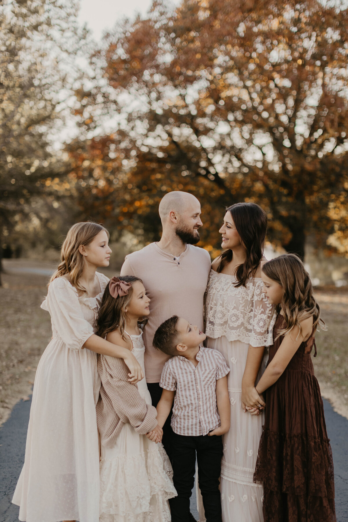 Family of 6 in close embrace. 