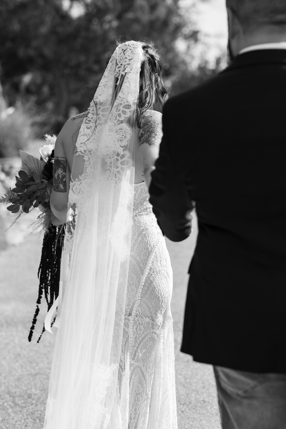 black and white photo of bride and groom in texas hill country