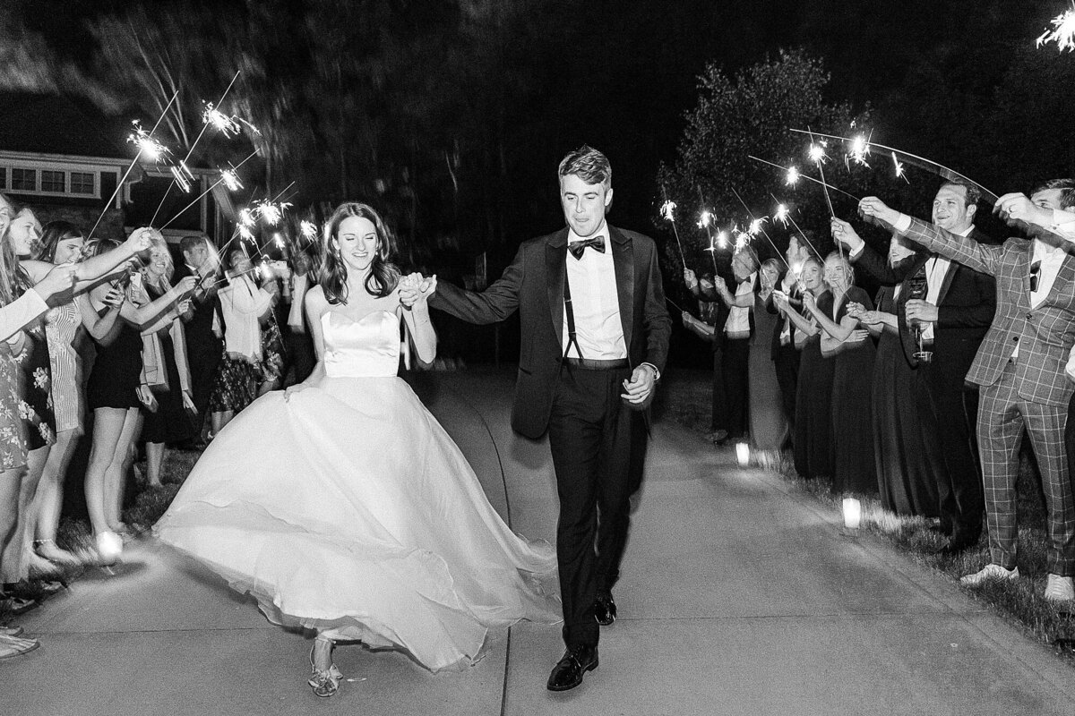 Bride and Groom's sparkler exit at the end of their intimate tented estate wedding reception