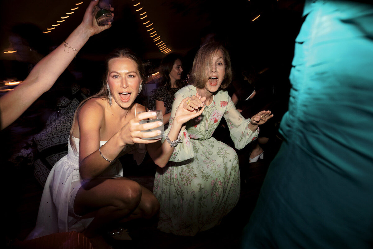 adirondack-mountain-wedding-43-couple's-joyful-grand-exit-with-sparklers-held-by-guests-at-adirondack-mountain-wedding-jenny-fu-studio