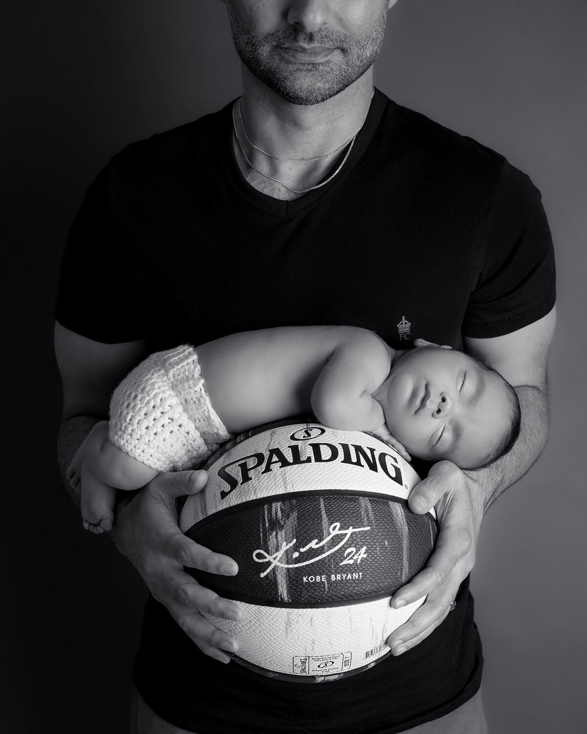 Tally Safdie photography newborn session nbaby on basketball