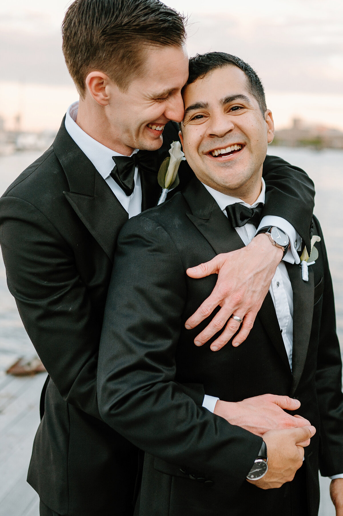 Grooms embracing with joy
