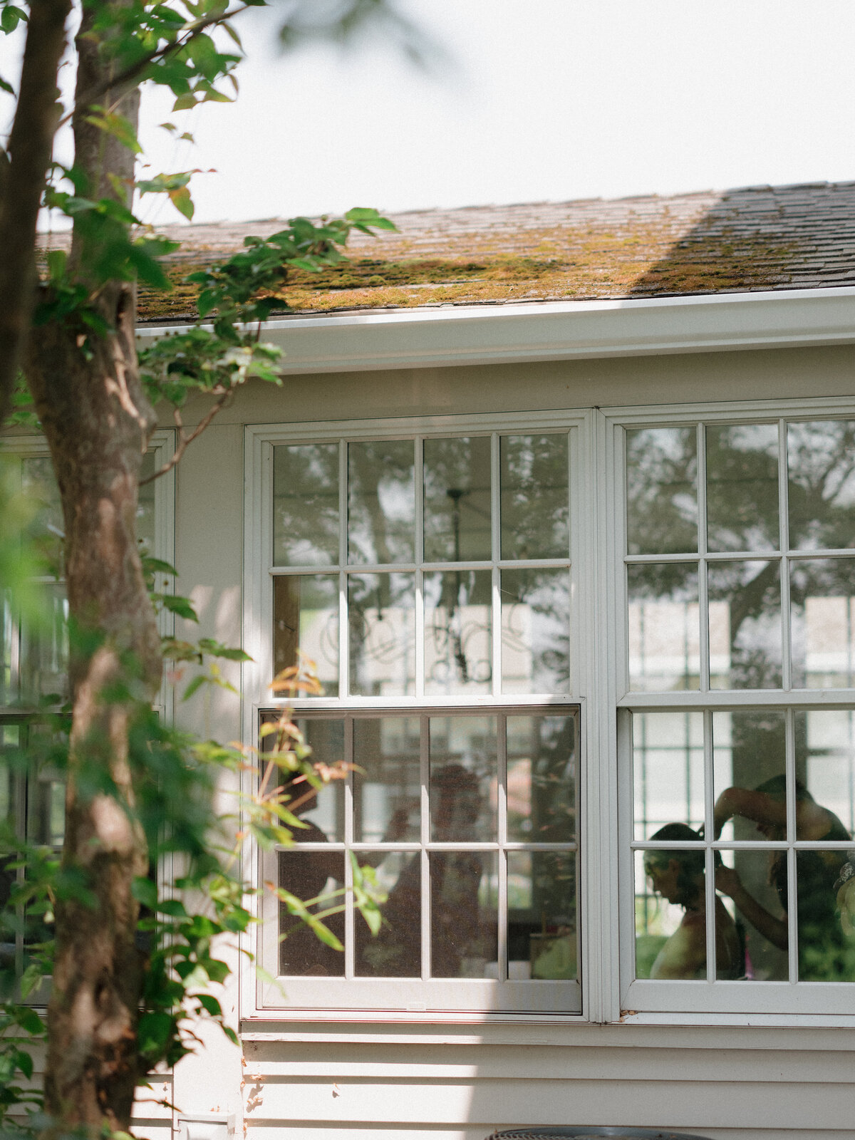 Breathtaking wide-angle ceremony photograph showcasing the architectural grandeur of Lion Rock Farm's historic barn venue. This editorial wedding photography captures the intimate ceremony moment with fashion forward composition, demonstrating why Lauren Alatriste is Connecticut's premier luxury destination wedding photographer specializing in architectural and editorial aesthetics.