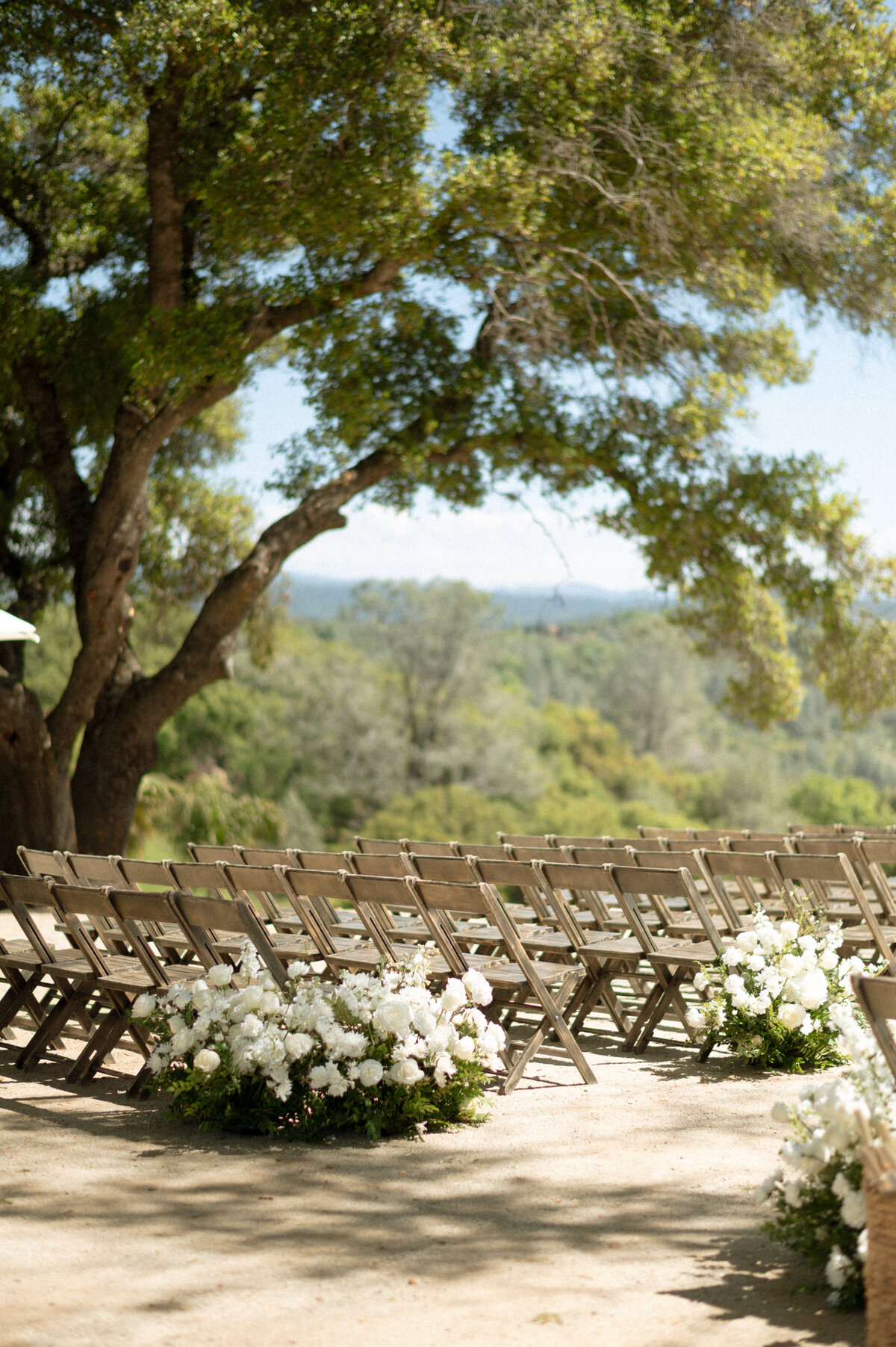 white-florals-ceremony-chairs