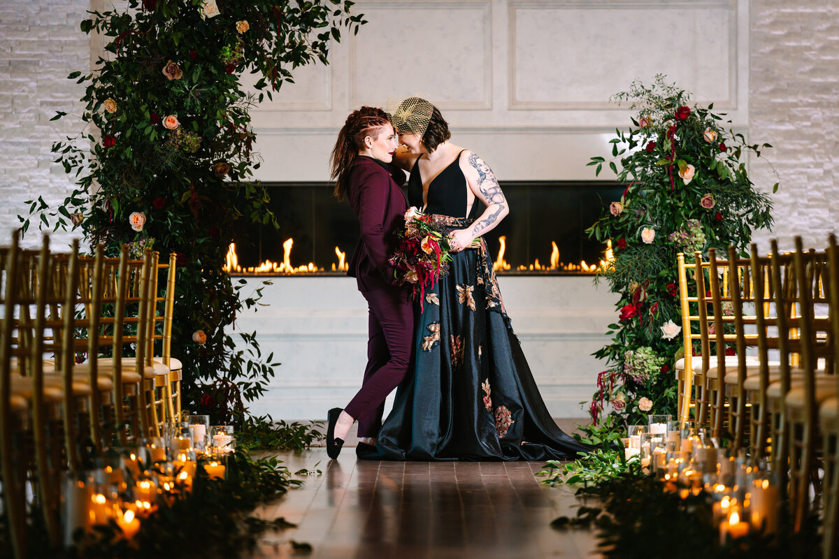 Brides kissing at the wedding alter