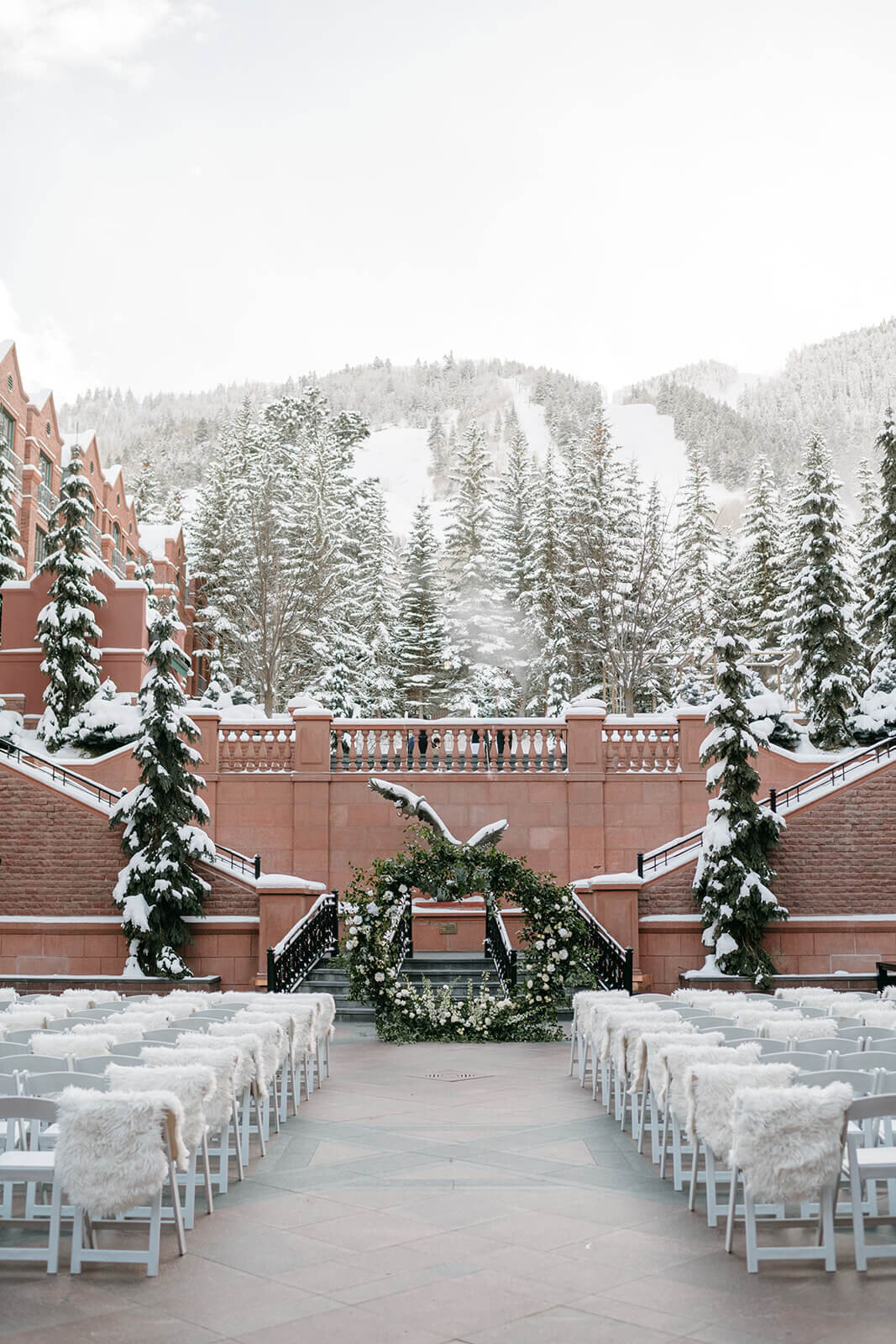 Stunning snow draped view of the outdoor wedding ceremony site at Aspen St. Regis.