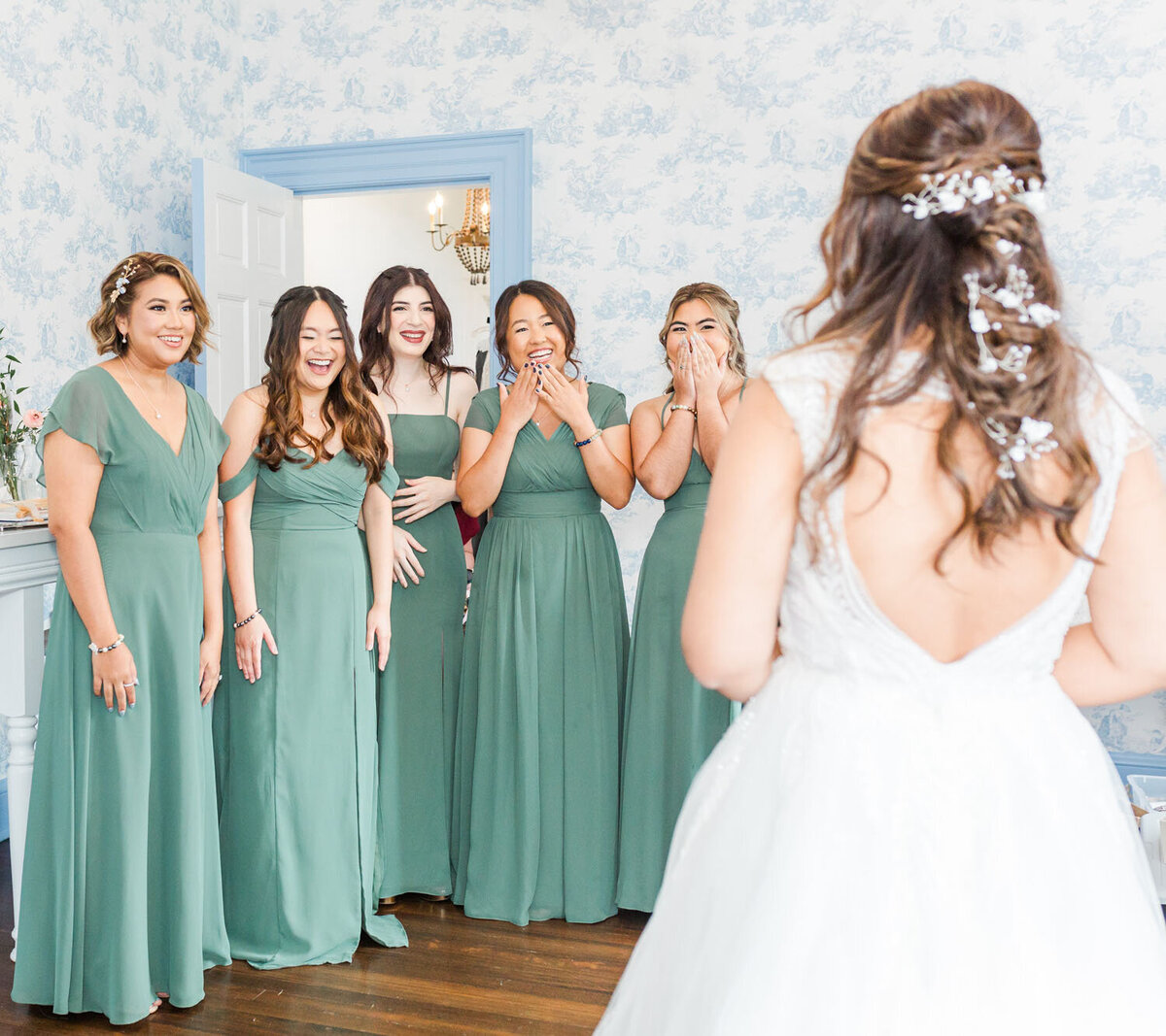 Wedding party's first look of the bride