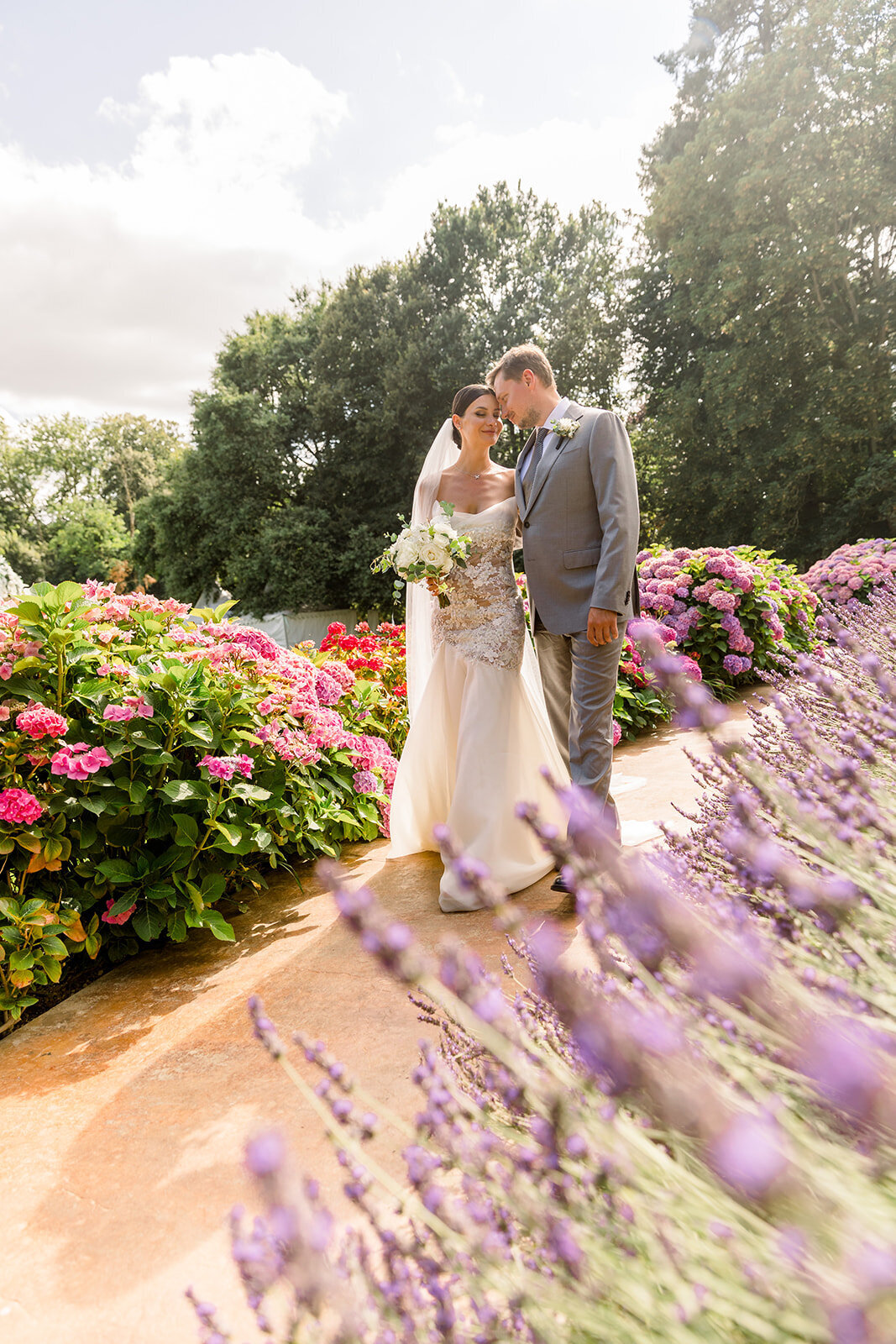 Bride and groom dancing outdoors, captured in a romantic moment during a Loire Valley elopement