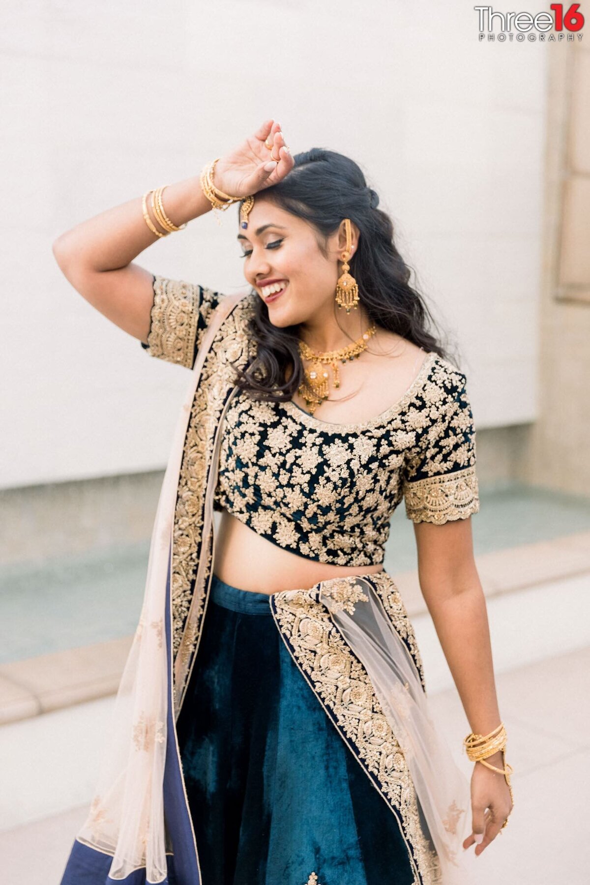 Indian Bride has fun during her photo shoot after the ceremony