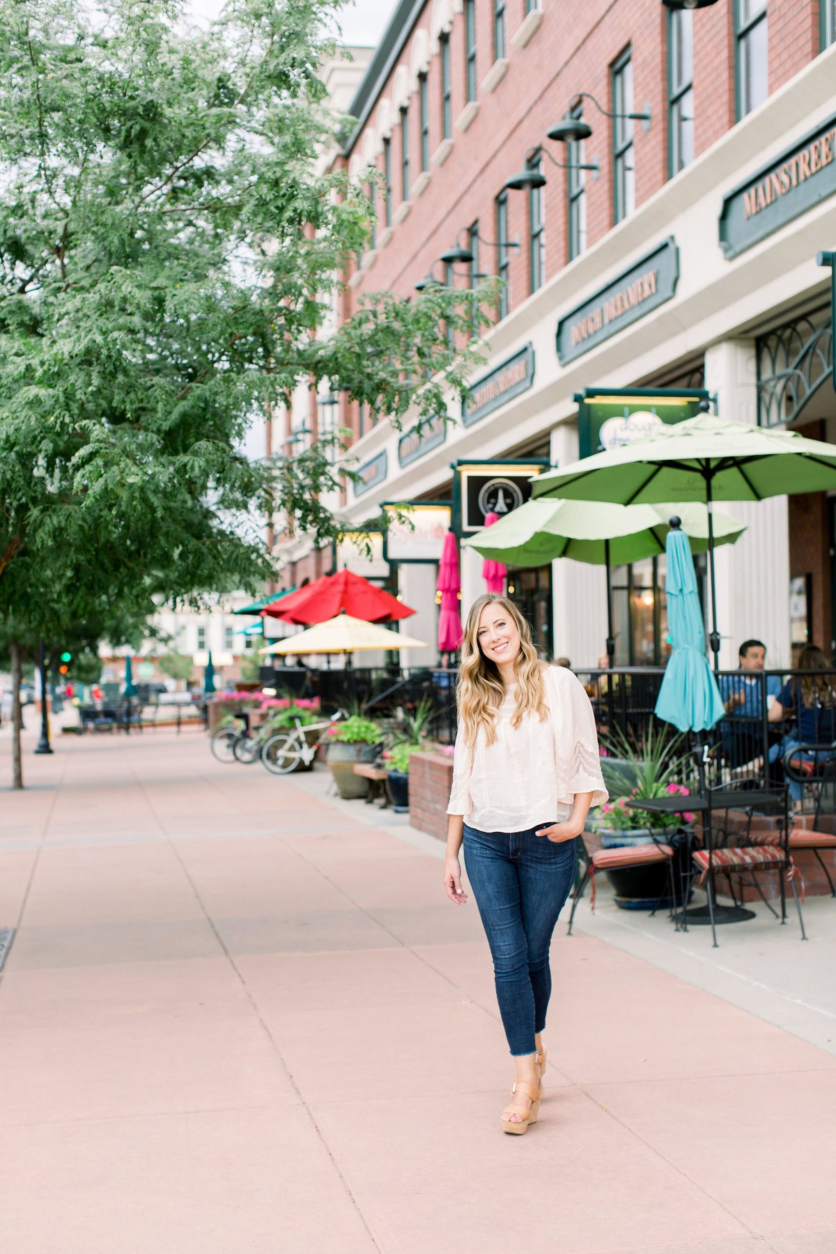 Image of female business owner standing on street