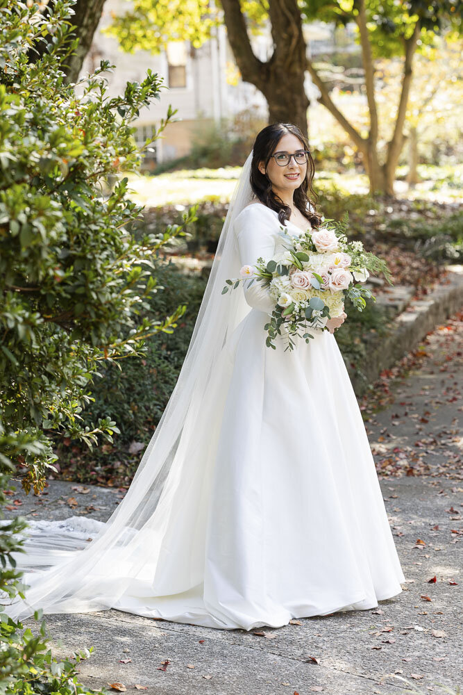 bride in a wedding dress holding a bouquet