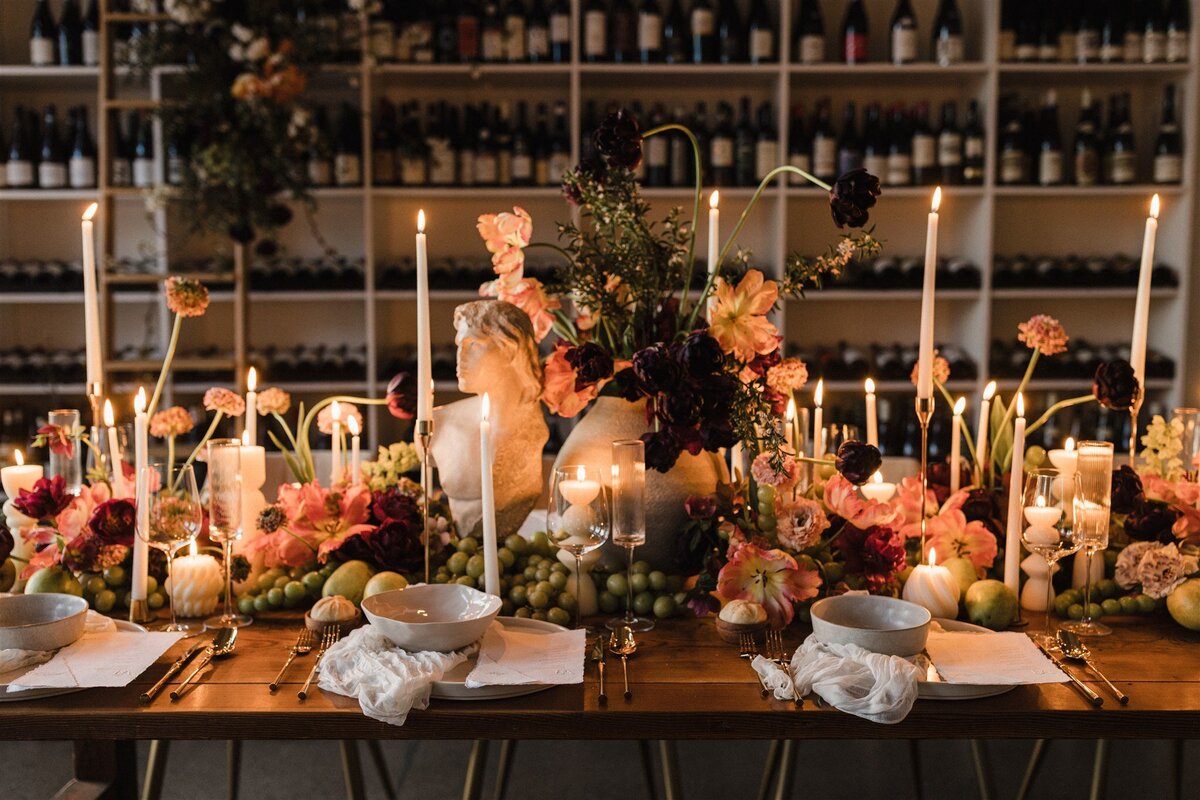 Modern baroque wedding table with sculpture, candles, and hellebore