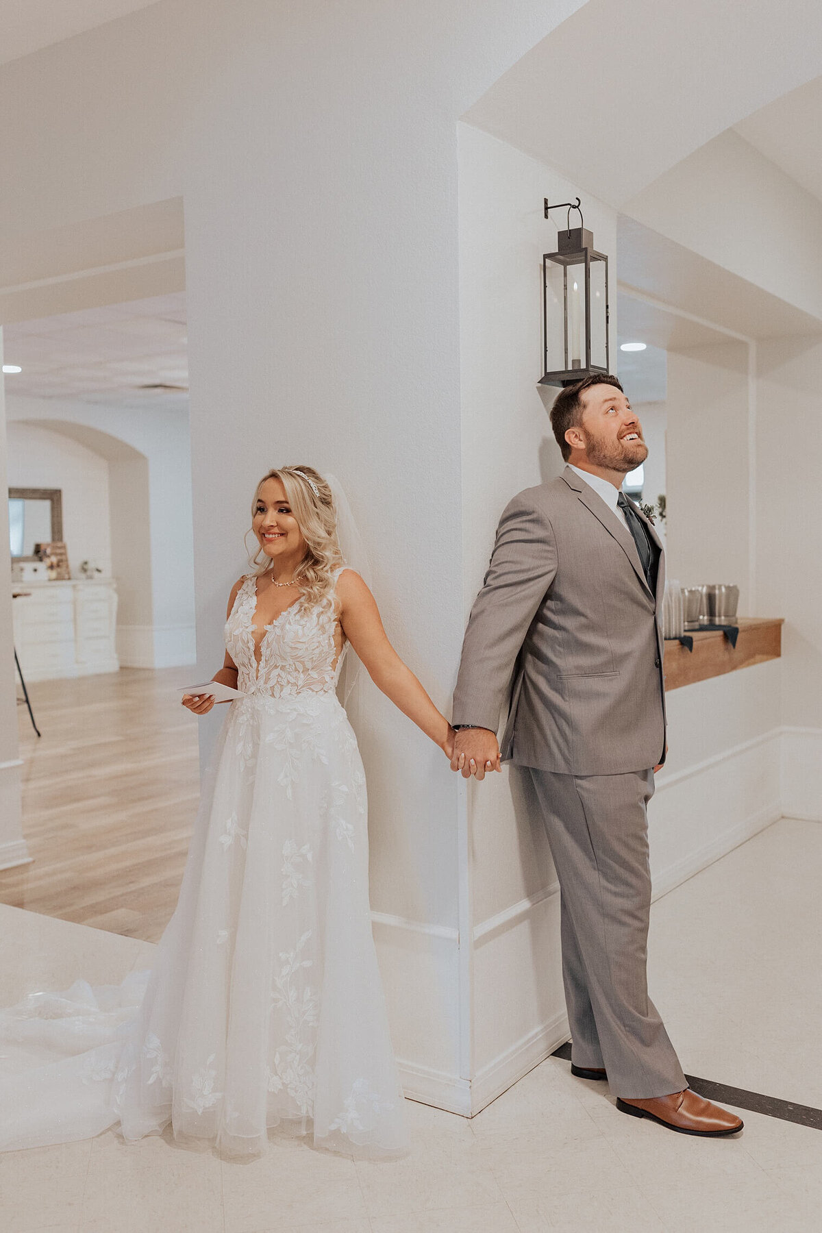 bride and groom having a first touch before wedding at creekside event center, CO