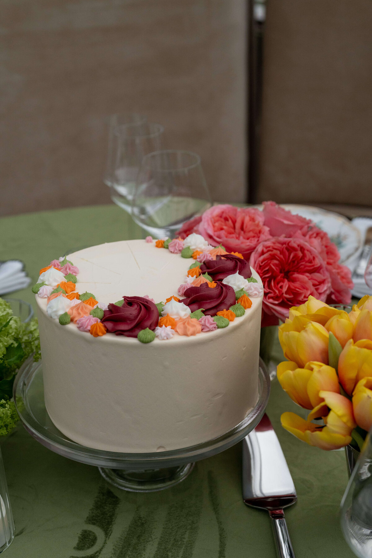 Wedding cake sitting at guest tables