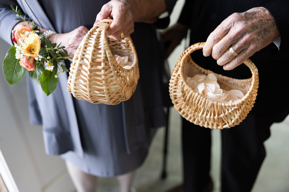 flower grandma and grandpa holding baskets of flower petals as ceremony is about to start