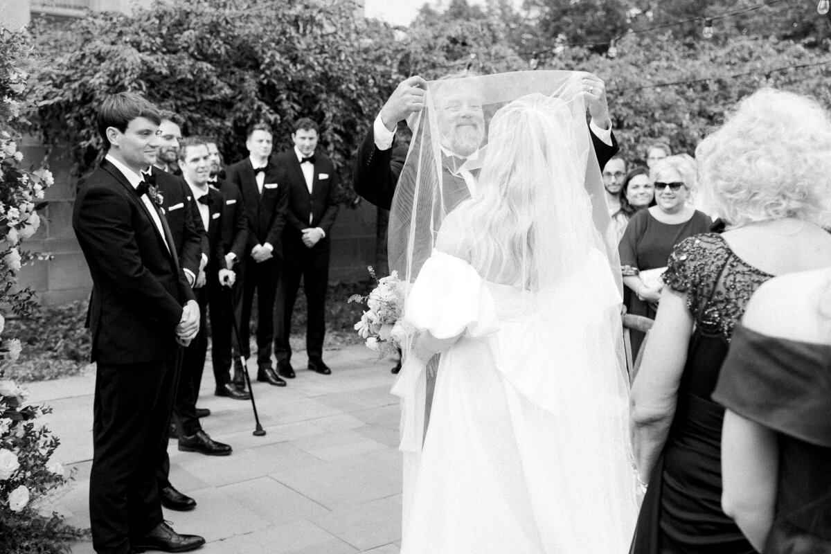 Photo of dad giving bride away