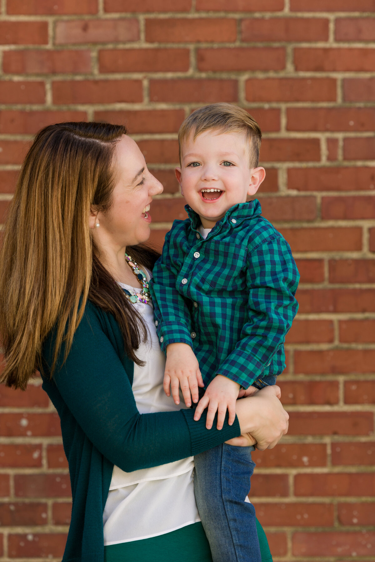 A family captured in a candid walking scene, making lasting memories during an exciting mini photography session in King of Prussia.