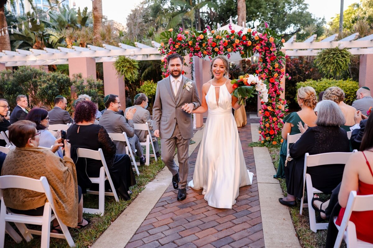 19 - Vinoy Hotel Wedding Tea Garden Jewish Ceremony Recessional - Tampa Bay Wedding Planner