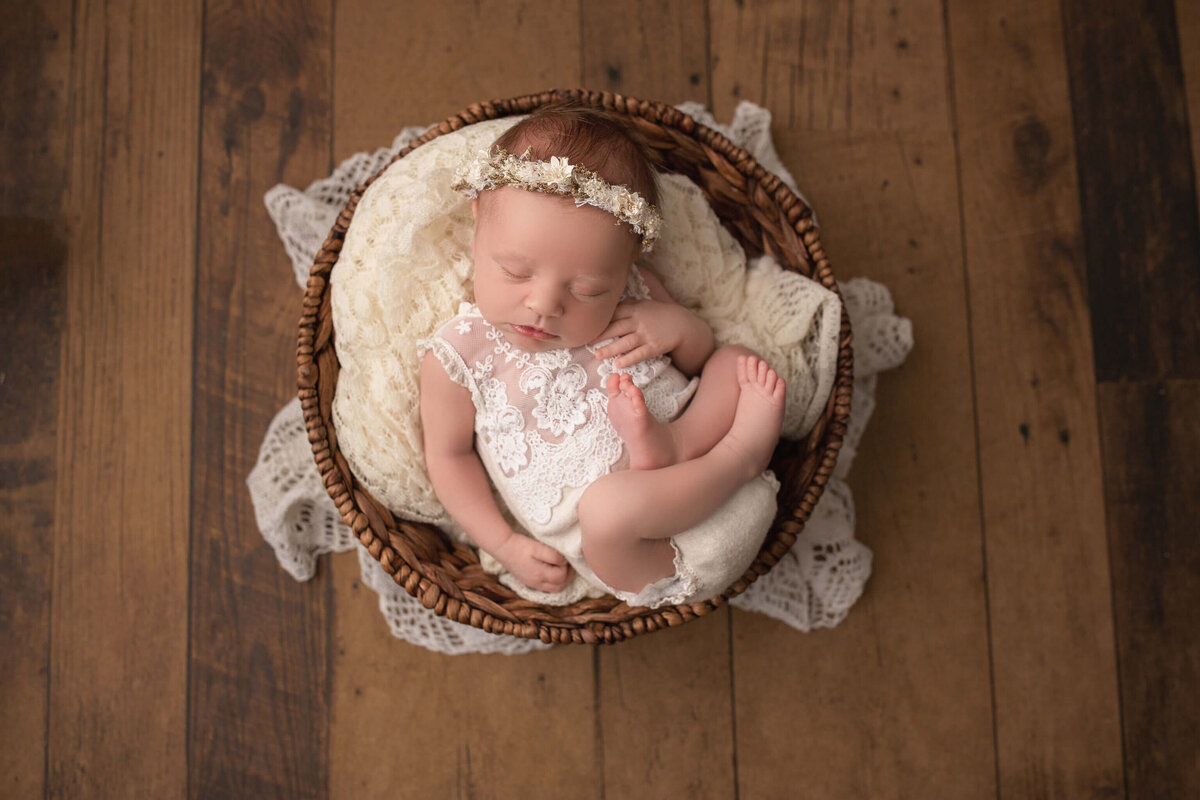 newborn baby girl in basket edited with newborn photoshop actions