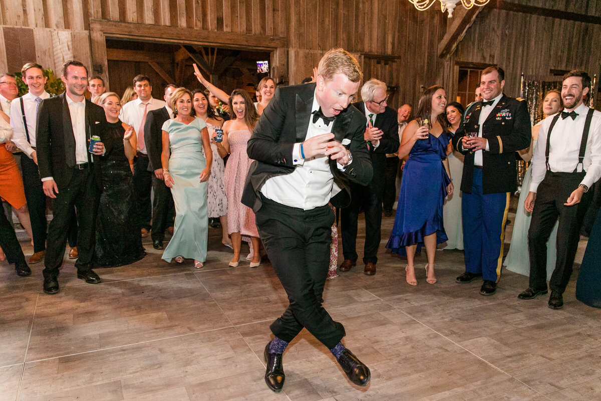 Groomsman dancing at a Boone Hall Plantation elegant spring soiree wedding  |  Charleston wedding photographer Dana Cubbage Weddings