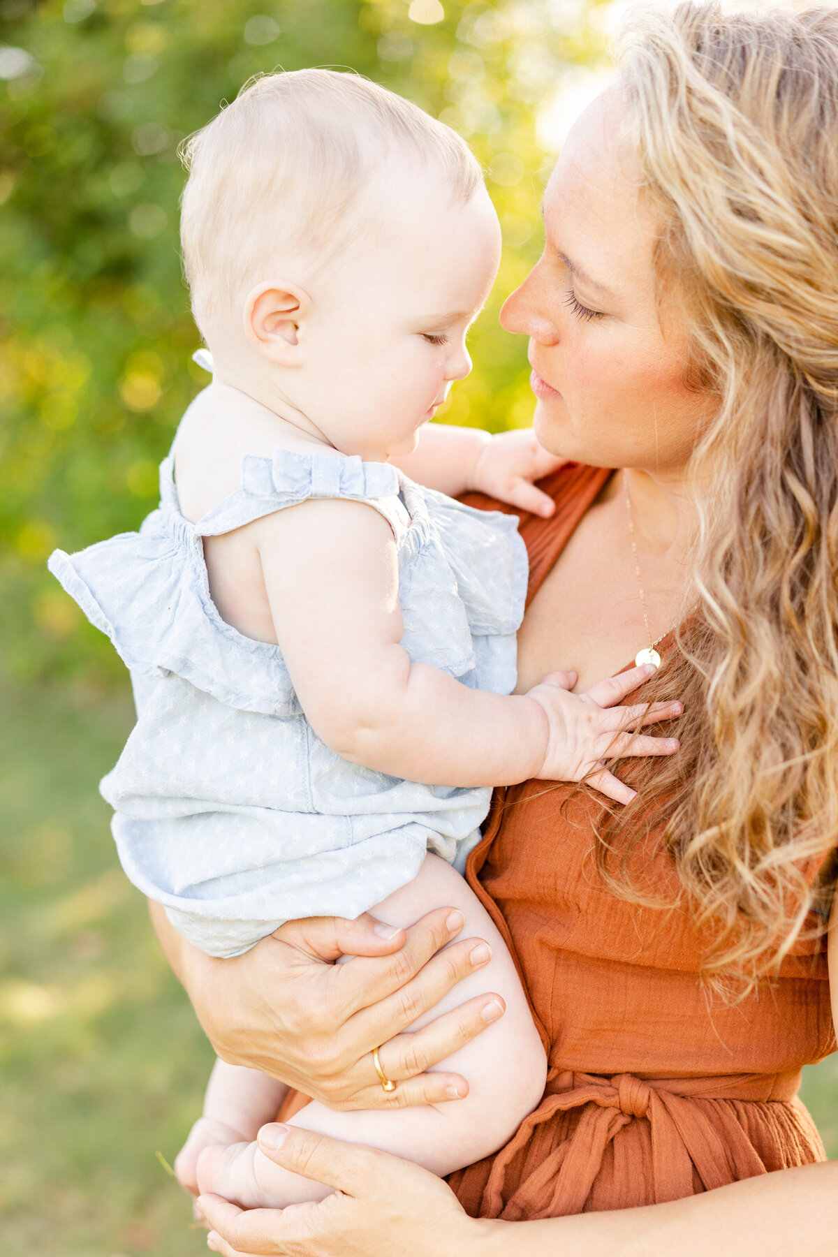 a mother holds her toddler
