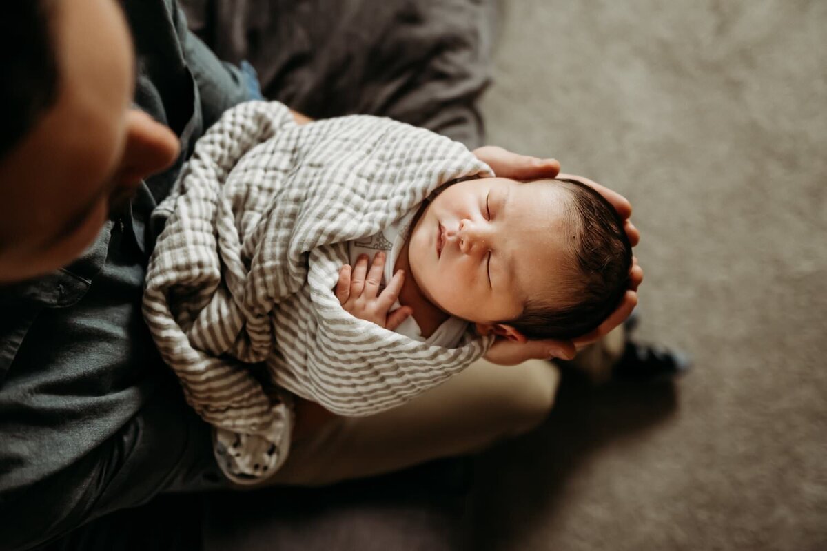 dad-holds-new-son