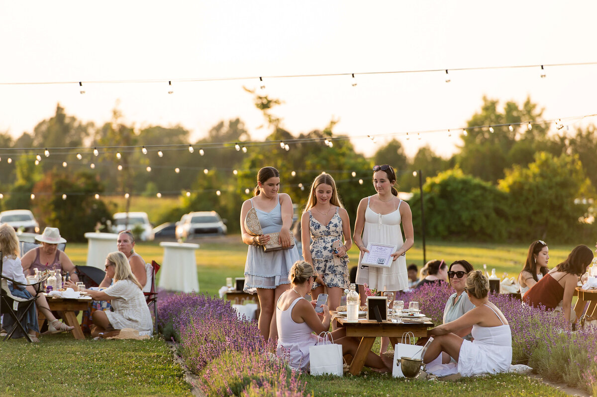 Charcuterie boards being served to guests at Soiree in the Field.  Captured by Ottawa Event Photographer JEMMAN Photography COMMERCIAL
