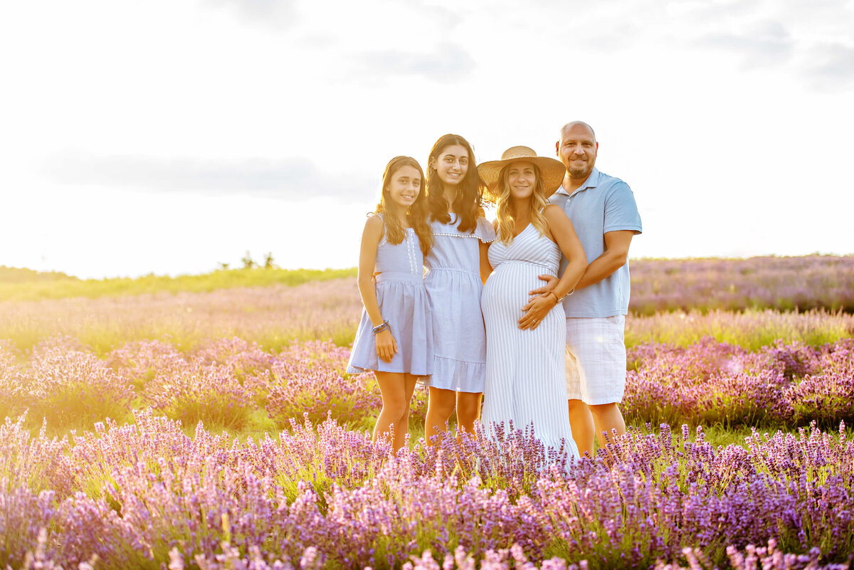 family maternity photography session in the golden hour in Burlington, Ontario in a lavender field
