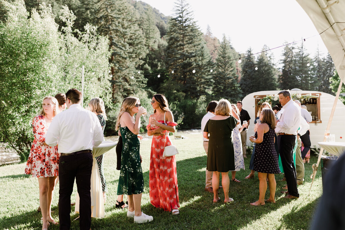 Guests mingling at wedding reception at Dallenbach Ranch Colorado Wedding