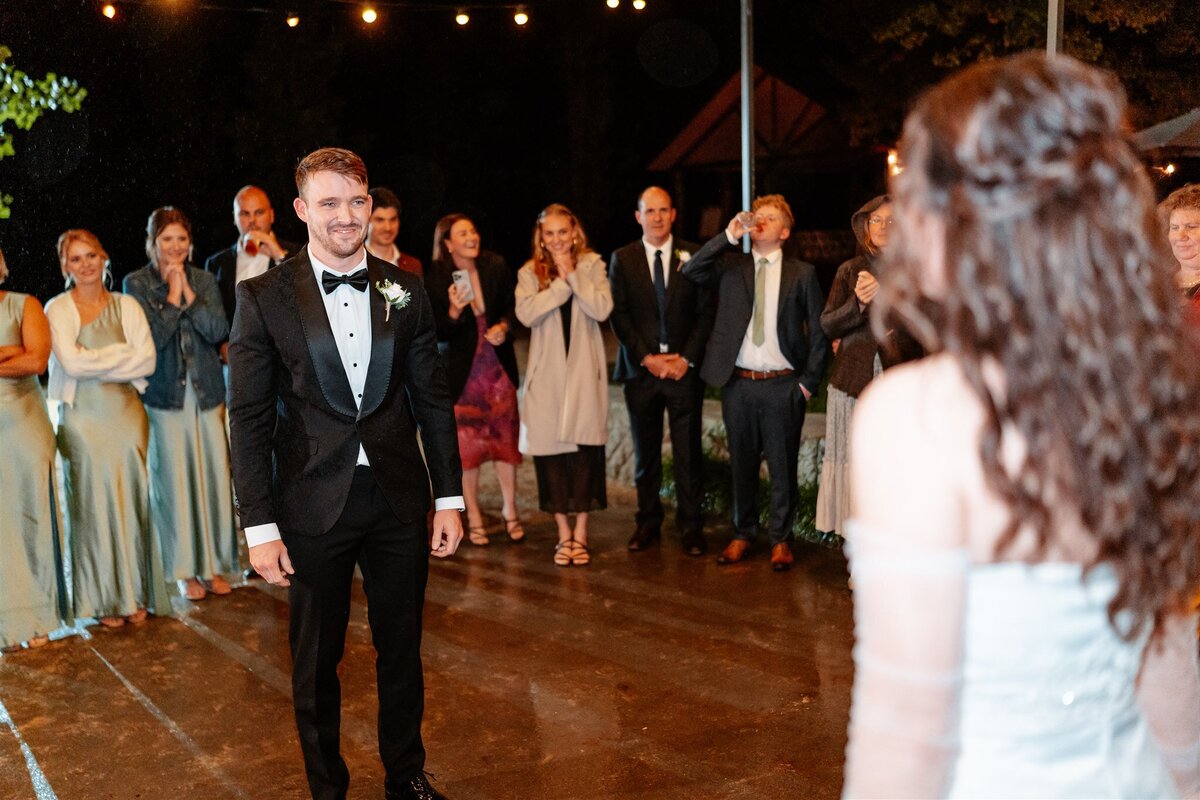 A blissful moment captured: a couple joyfully dances at their wedding reception, encapsulating love and celebration in a single frame.