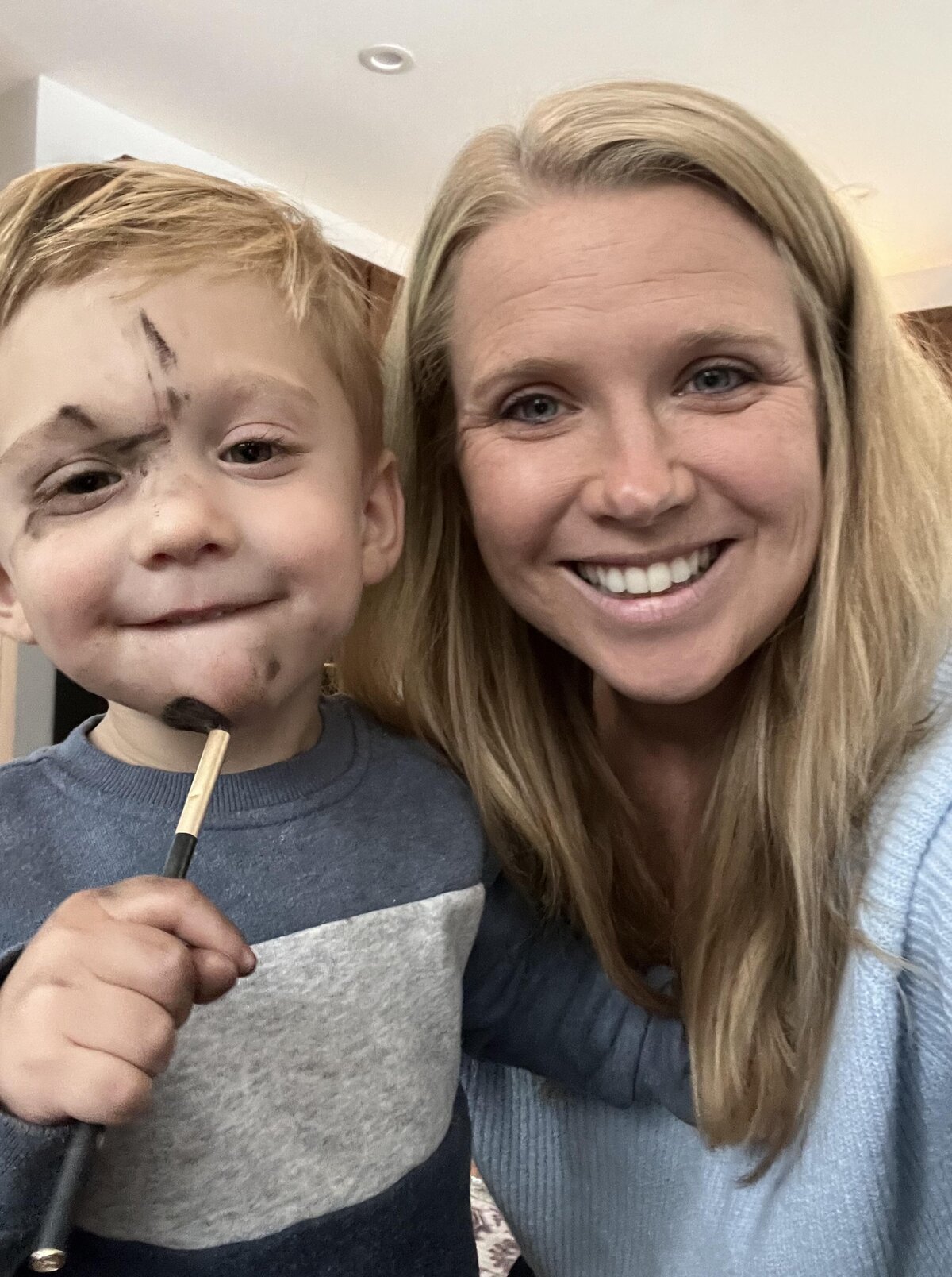 Toddler does his makeup with moms makeup brushes getting covered in brown eyeshadow