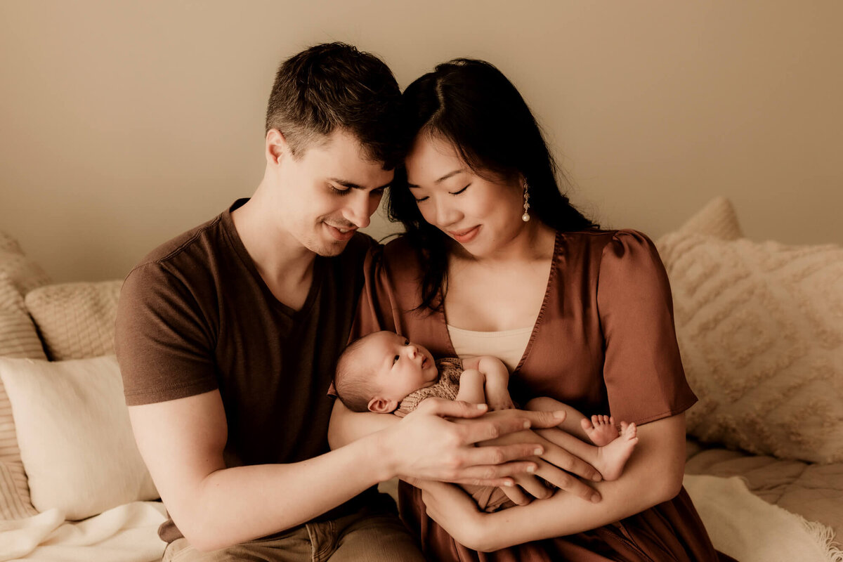Parents hold their newborn son in OKC.