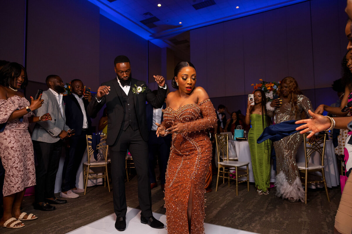 Tomi and Tolu Oruka Events Ziggy on the Lens photographer Wedding event planners Toronto planner African Nigerian Eyitayo Dada Dara Ayoola ottawa convention and event centre pocket flowers Navy blue groom suit ball gown black bride classy  199