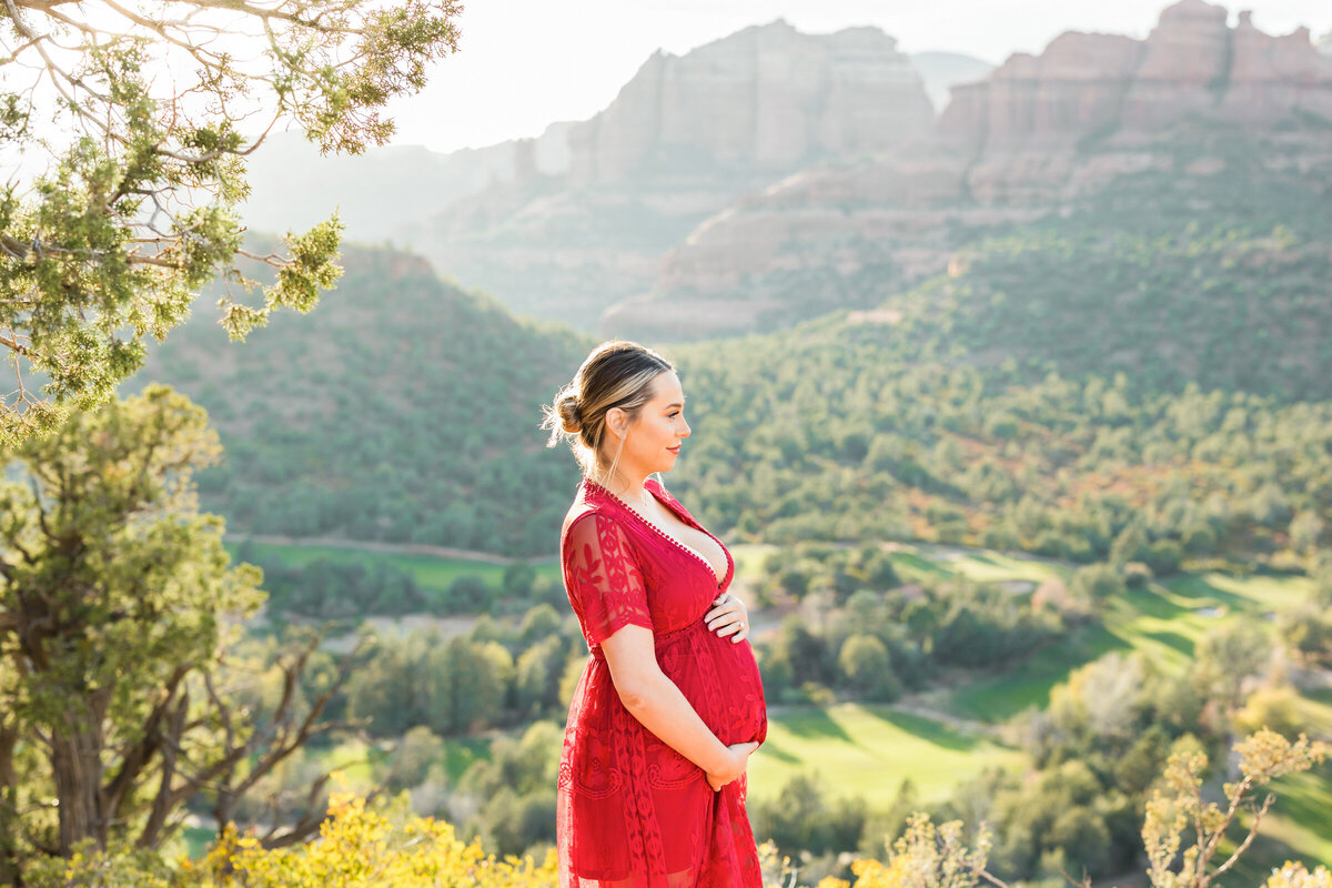 pregnant woman holding bump in Sedona