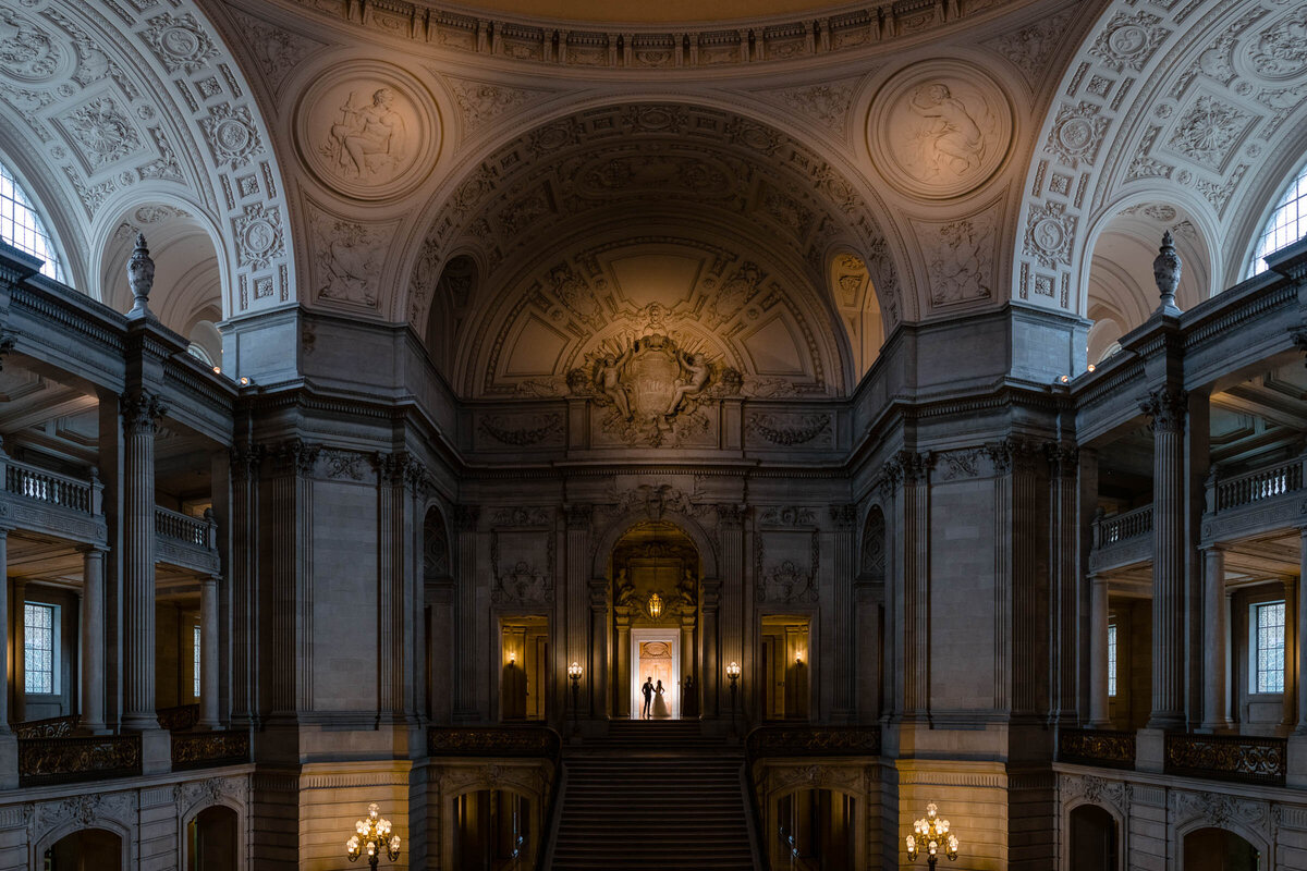 Professional wedding photographer San Francisco captures dramatic City Hall rotunda with ornate dome and classical details