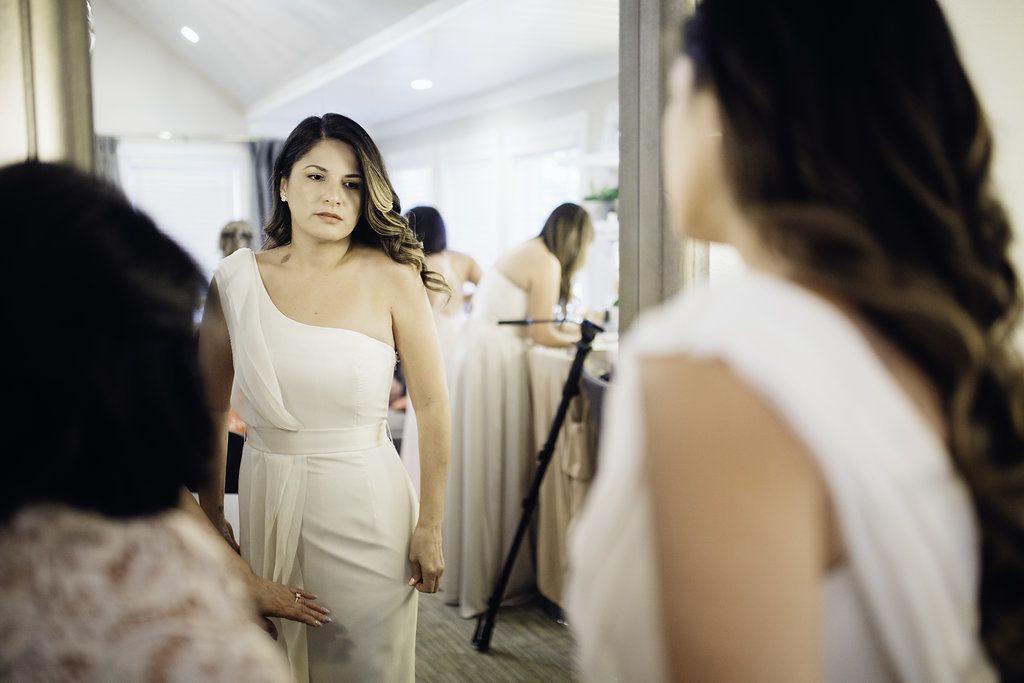 Wedding Photograph Of Woman Checking Her dress in Front Of a Mirror Los Angeles